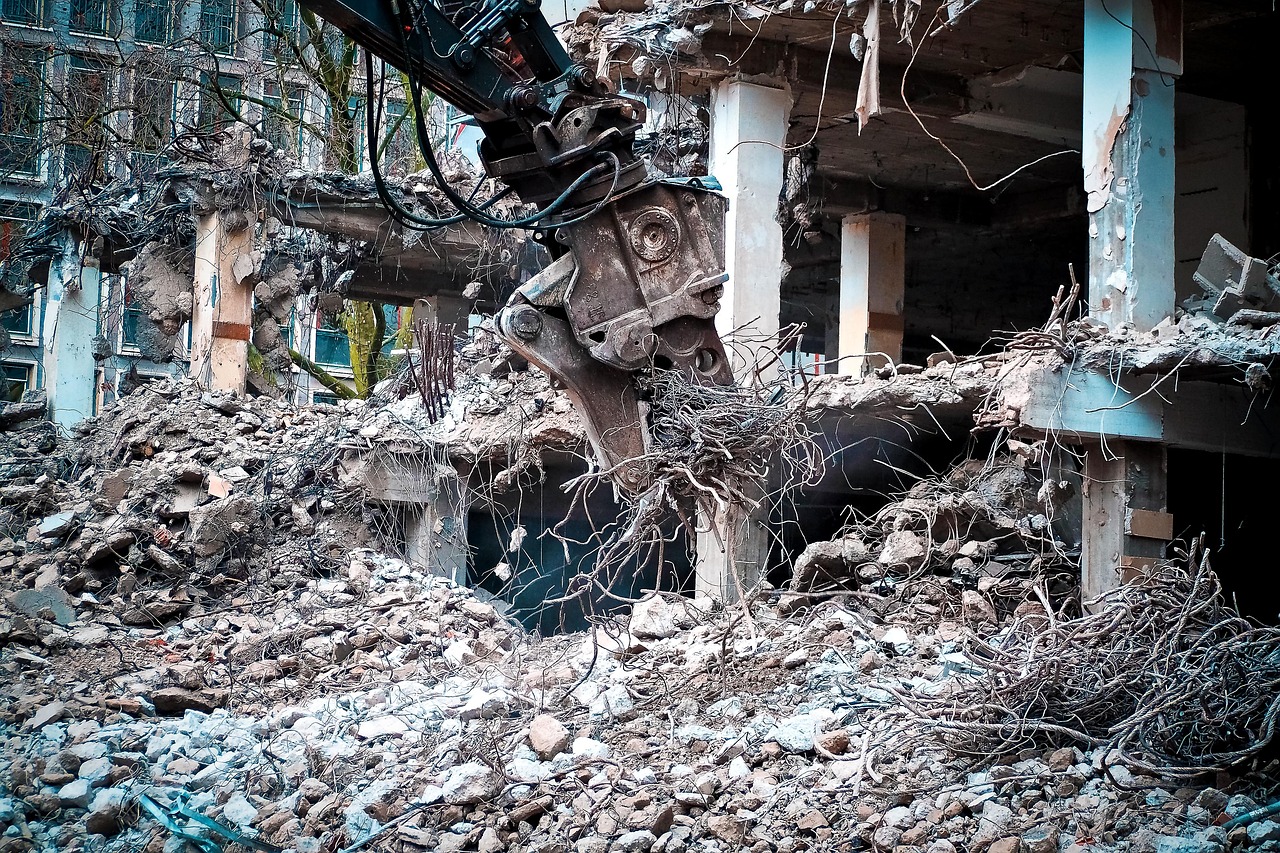 Excavator grading a building pad in Bentonville, AR
